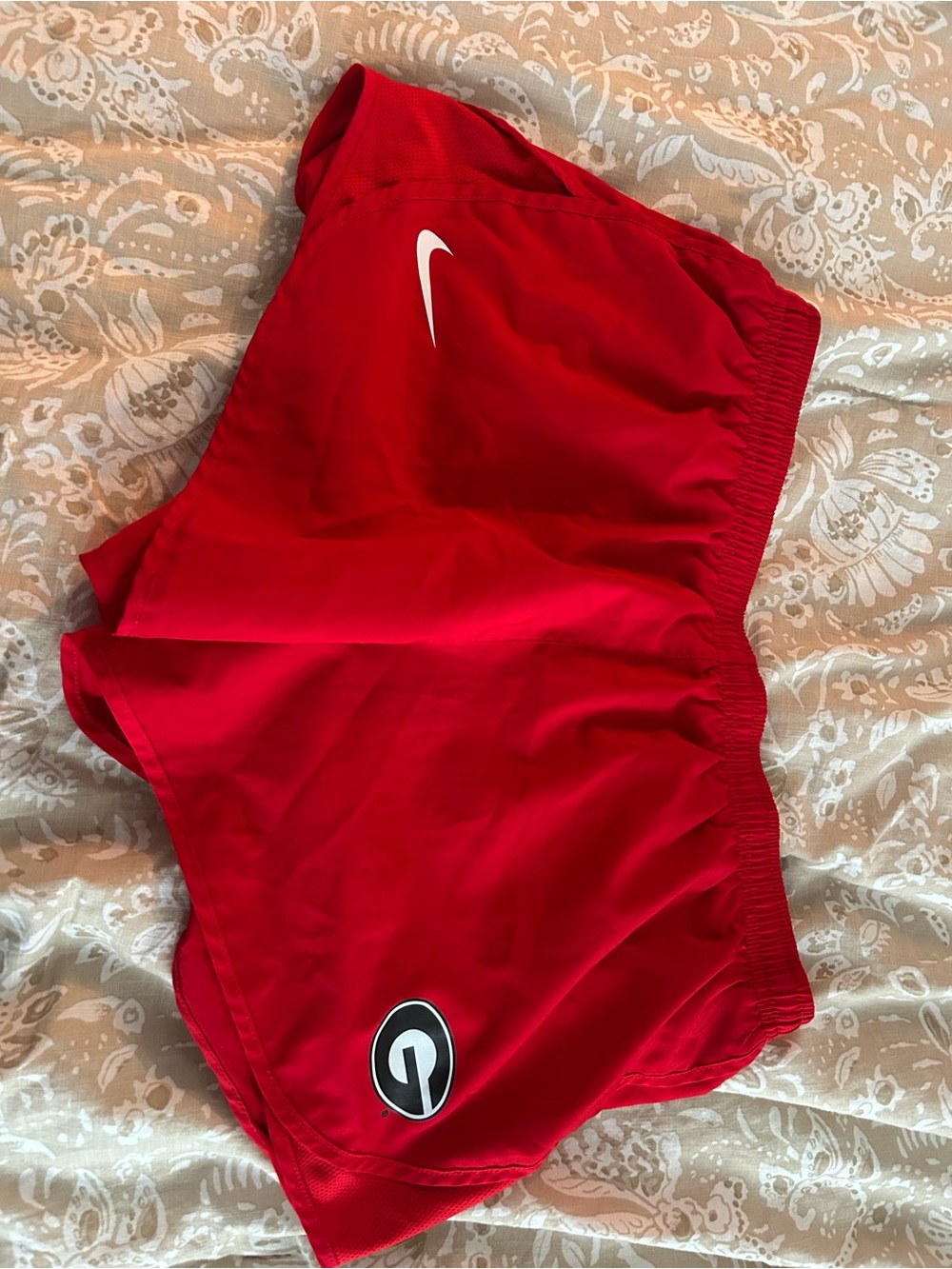 Nike Women’s Red Athletic Shorts with White Swoosh